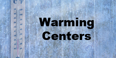 Thermometer on wood and warming centers