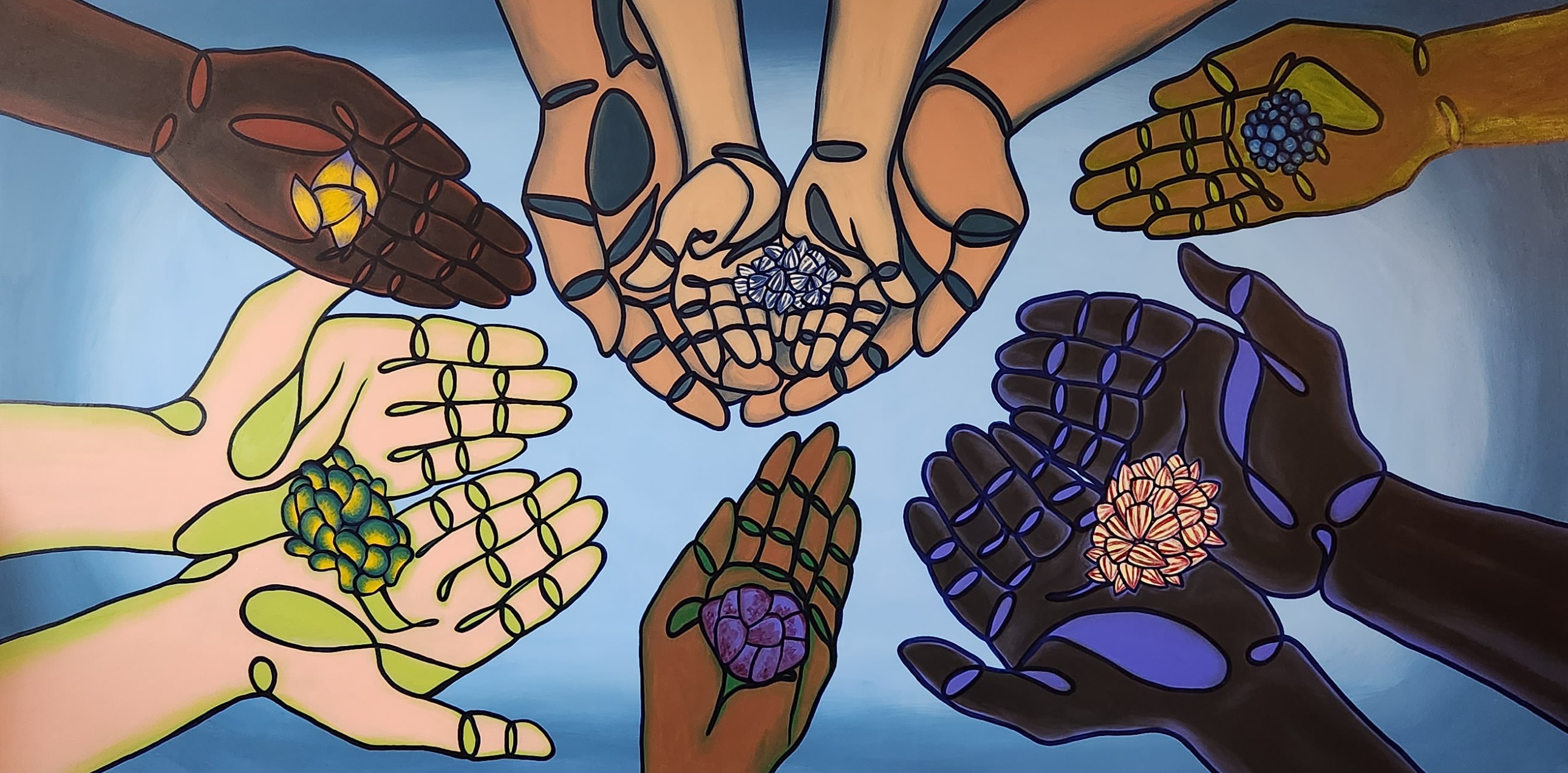 People stand in a circle, their outstretched palms filled with different seed varieties. Their hands are different colors, including white, black, and brown. 