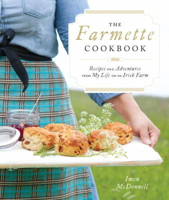 Woman in plaid skirt holding tray of baked goods