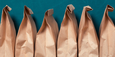 brown lunch bags in a row
