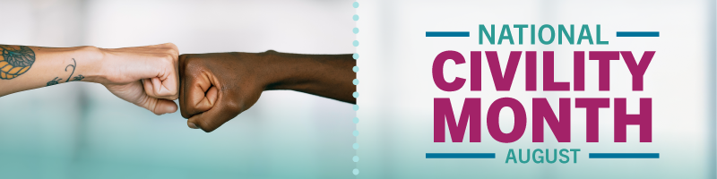 Two arms coming together in a fist bump