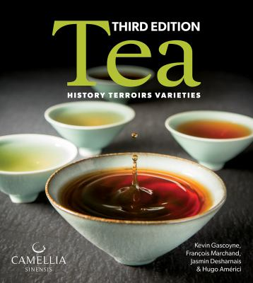white, crackle glazed handle-less cups with varying shades of tea from pale yellow to deep brown