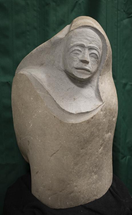 zimmermancraig_wintersorrow-cw.jpg A sculpture of a bald man in robes, his frowning, wrinkled face visible beneath his hood.