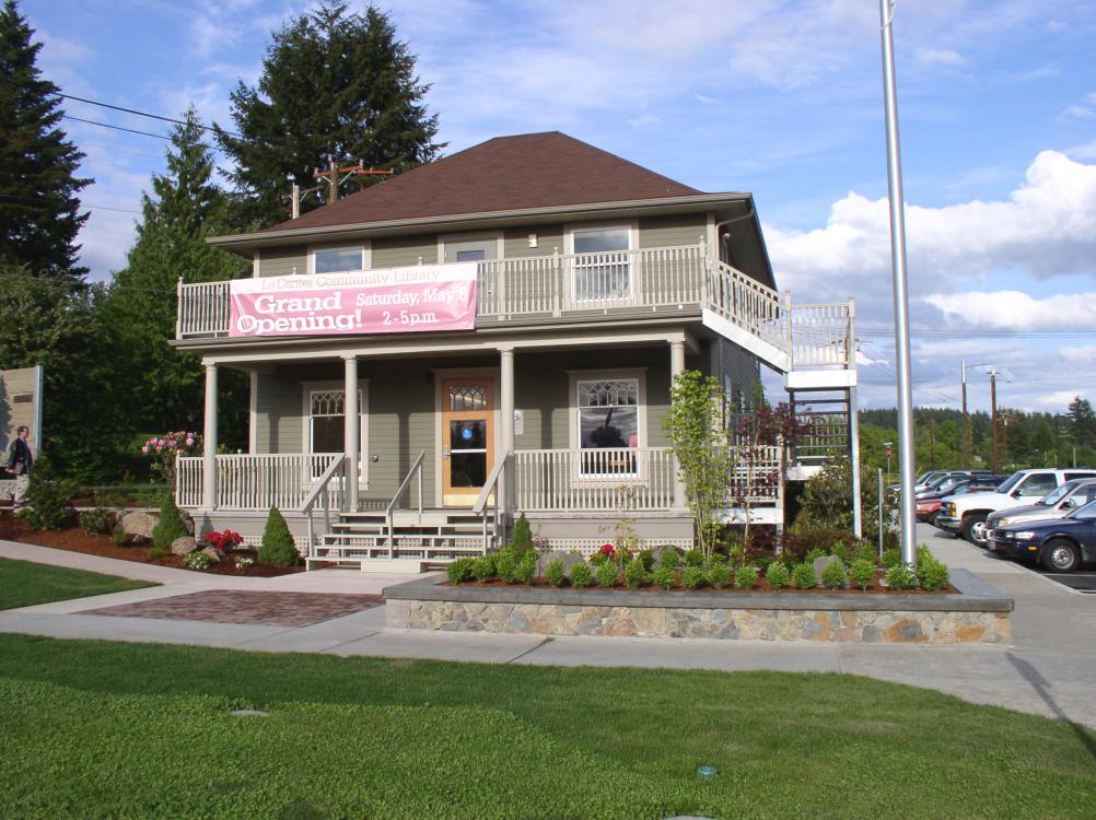 Photo of the exterior banner attached to the La Center Community Library building, circa May 8, 2004