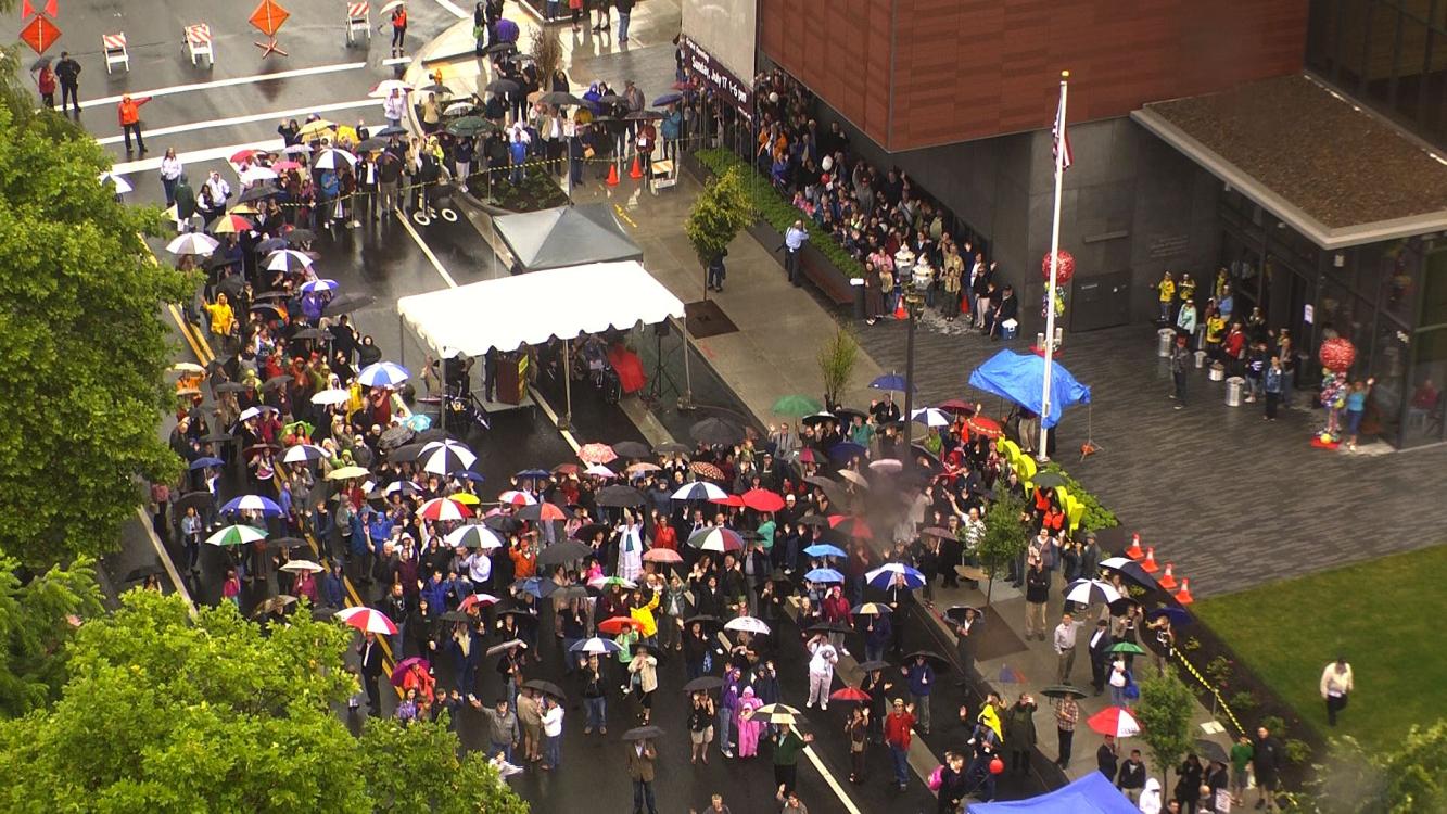 Photo of a crowd gathered outside for the grand opening of Vancouver Community Library, July 17, 2011