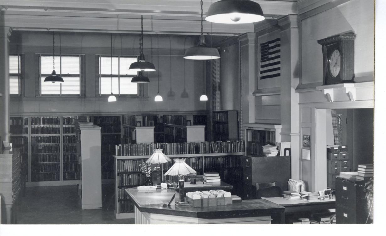 Black-and-white photo of the Carnegie Library circulation desk