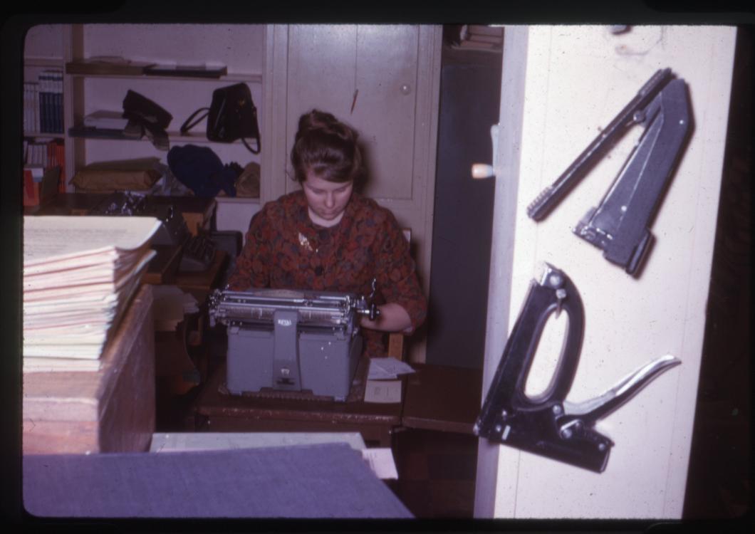 Picture of a Carnegie Library worker using a typewriter, circa the early 1960s