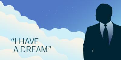 Silouhette of Martin Luther King, Jr against blue sky with white clouds